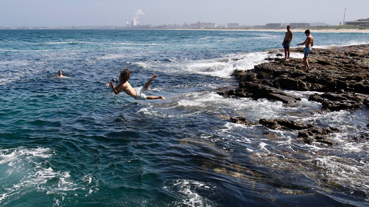 Teens cool off in the ocean at Wollongong's Flagstaff Point earlier this month. Picture: Adam McLean
