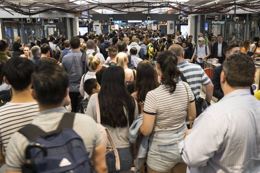BUSY: Overcrowding at Town Hall station during peak hour on Tuesday evening. A lack of staff, plus damage to rail infrastructure caused by lightning, led to long queues and overcrowding at major Sydney stations. Picture: Louie Douvis