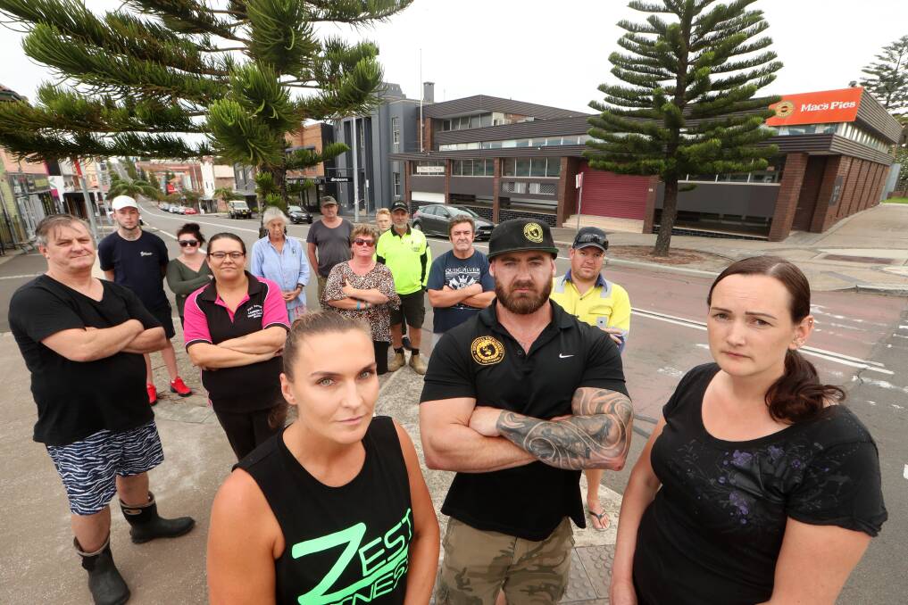 CONCERNED: Tracey Tolson, from Zest Fitness; Stu Shannon, from Universal Supplements; and Port Kembla resident Caroline White with others concerned about a drop-in community centre on Wentworth Street. Picture: Sylvia Liber