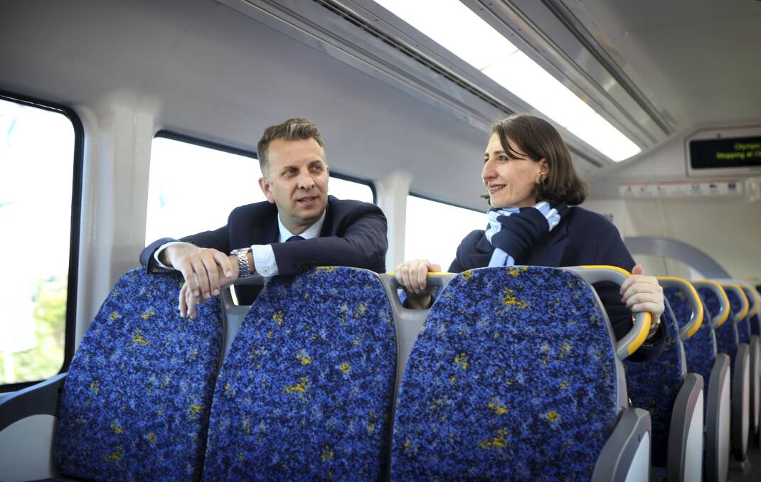 PLENTY OF ROOM: Minister for Transport and Infrastructure Andrew Constance joins NSW Premier Gladys Berejiklian for a test ride of a new Waratah train from Sydney Olympic Park to Central Station on Thursday. Picture: James Alcock