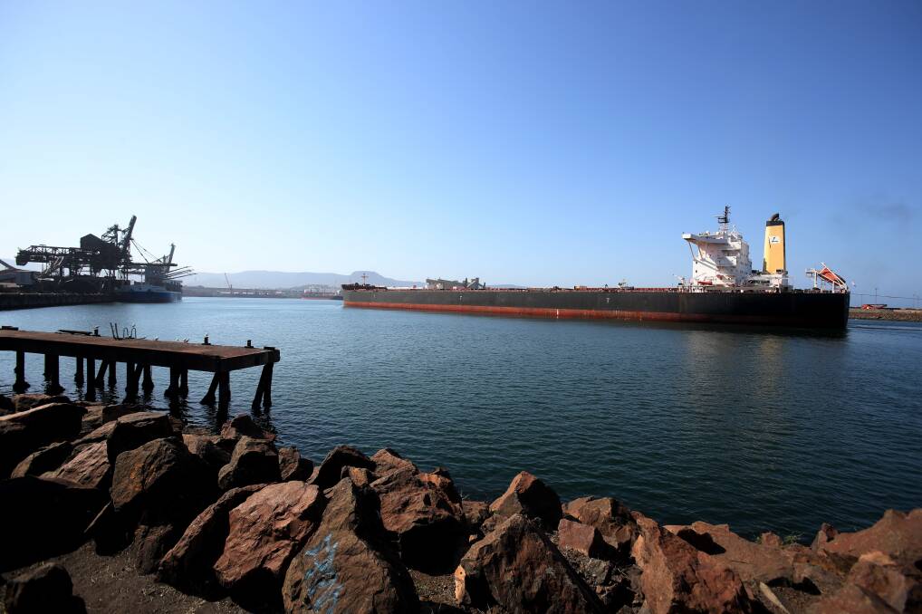 ARRIVAL: Greek-registered ship 'Heroic', its foreign crew and its cargo of 140,000 tonnes of iron ore from Port Hedland enter Port Kembla's inner harbour on Friday. The vessel berthed at BlueScope's discharge wharf. Picture: Robert Peet