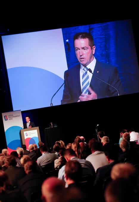 UP FRONT: Local Government Minister Paul Toole speaks during the Local Government NSW conference at the WIN Entertainment Centre on Tuesday. Pictures: Adam McLean