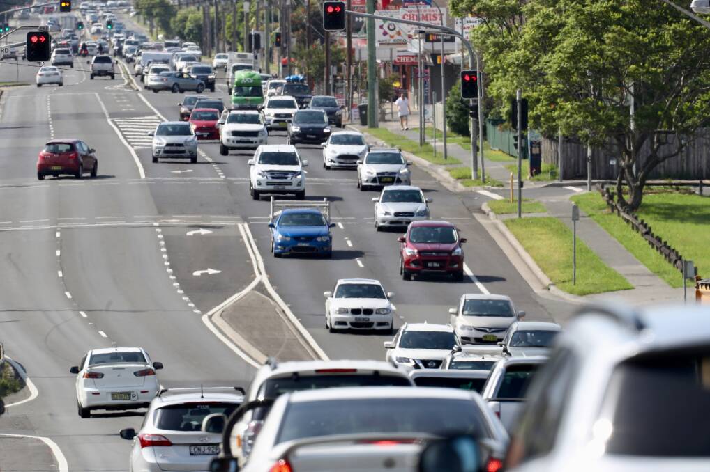BUMPER-TO-BUMPER: Holiday traffic on the Princes Highway at Albion Park Rail on December 22. Work on the suburb's long-awaited bypass will continue in 2018. Picture: Adam McLean