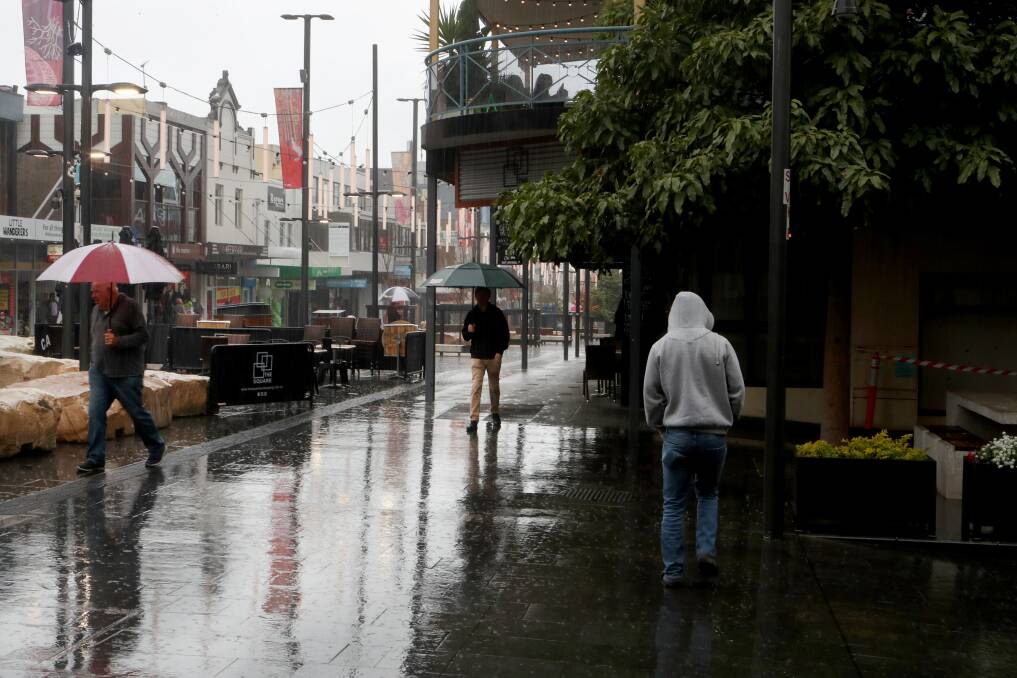 A wet Crown Street Mall in Wollongong on Wednesday. Picture: Sylvia Liber
