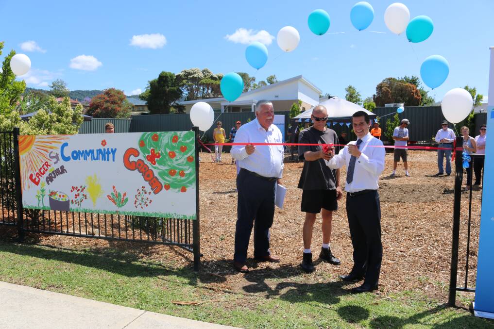 Chairman of the Housing Trust board David Campbell, resident Andy and Member for Keira Ryan Park open the Eager Street Community Garden. Picture: Supplied. 