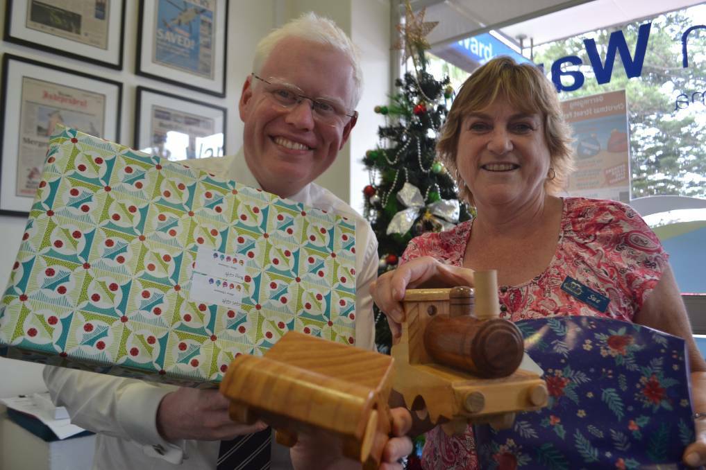 DONATION: Kiama MP Gareth Ward and Sue Redman, from Noah's Ark, with a few of the gifts donated as part of Mr Ward's Christmas toy drive. Picture: Rebecca Fist 