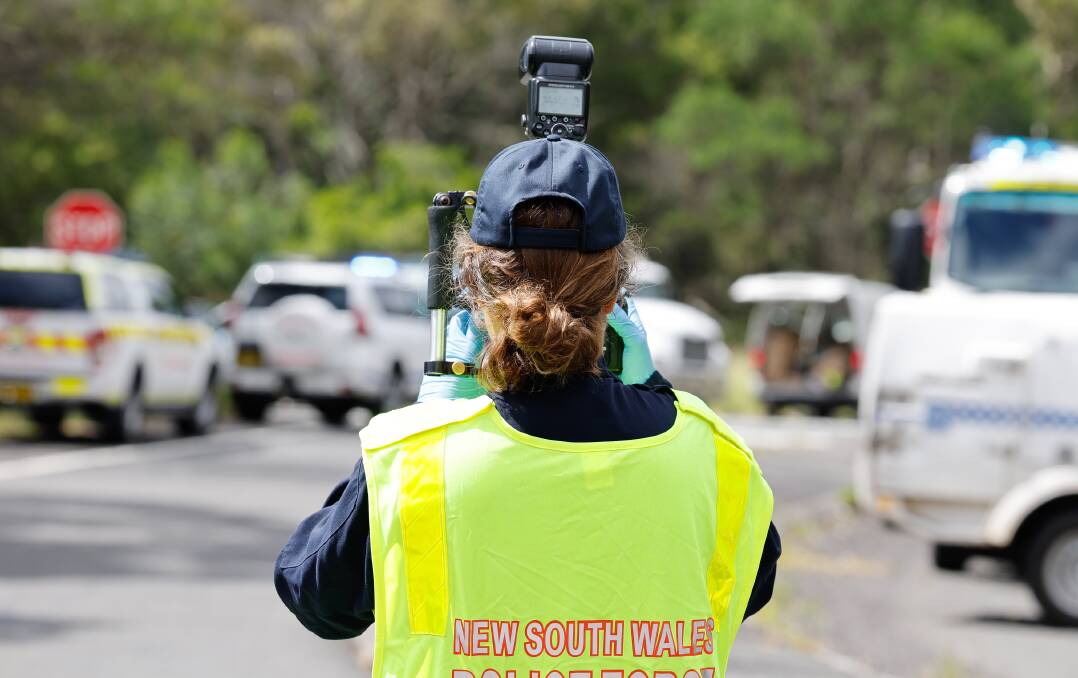 Emergency services at the scene of a fatal crash on Picton Road at Cataract on Friday, February 2. Pictures by Anna Warr