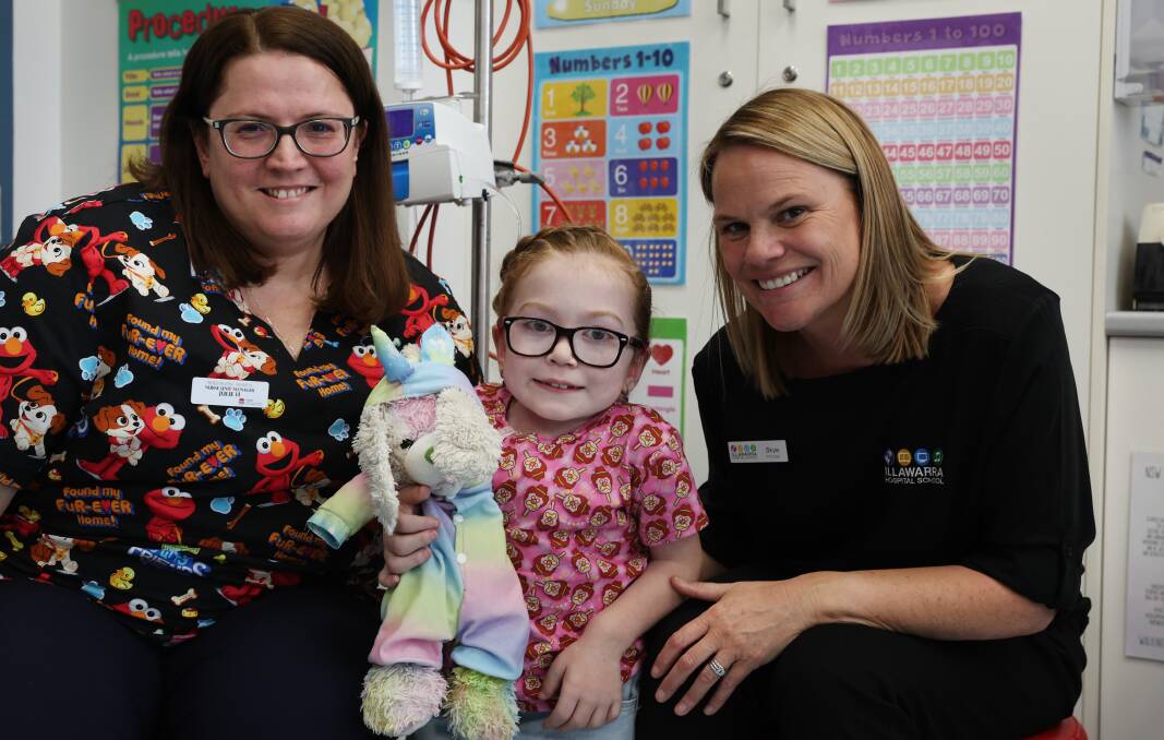 Wollongong Hospital children's ward nurse unit manager Julie Haines, Illawarra Hospital School principal Skye Gray and student Ivy Brown, 8. Picture by Sylvia Liber 