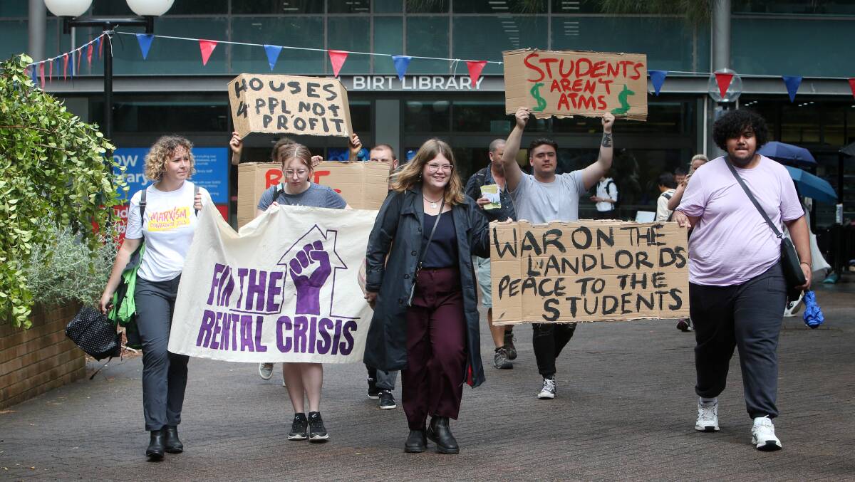 A small group of protestors are calling on the University of Wollongong to address the rental crisis facing students. Picture by Sylvia Liber