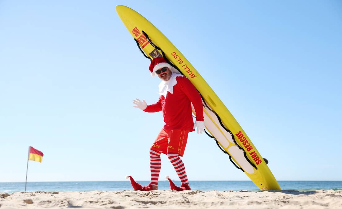 Naughty Elf at Bulli Beach is spreading beach safety messages and a whole lot of fun during December. Picture by Sylvia Liber