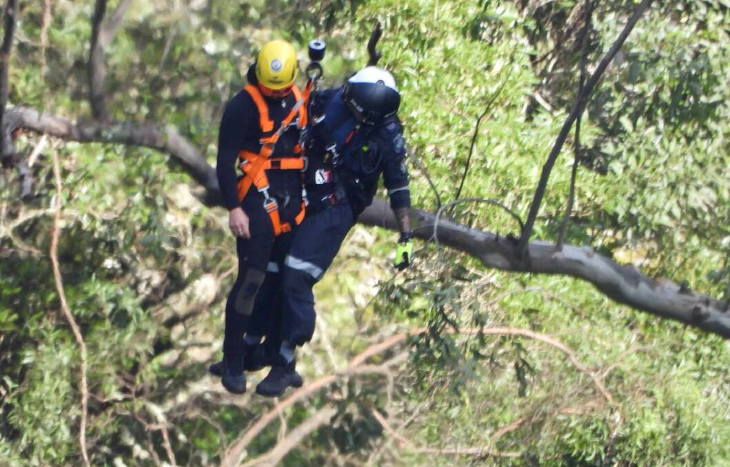 Rescuers searching for a missing woman who fell from a cliff at Belmore Falls on Sunday, April 8, 2024. Pictures by Darren Malone