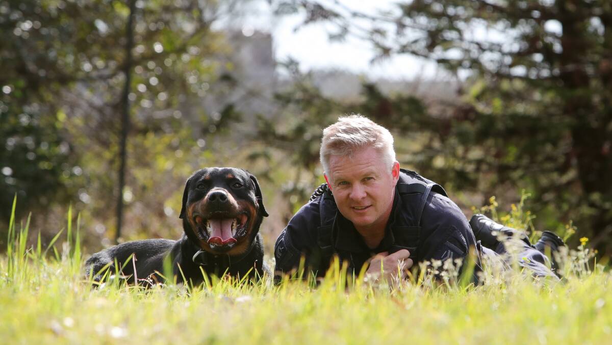 Senior Constable David Cole with his police dog Munsta. Picture by Sylvia Liber