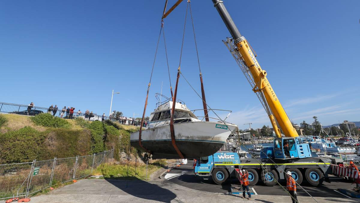 A 31-foot boat being lifted out and away from Wollongong Harbour on August 3. Picture by Adam McLean