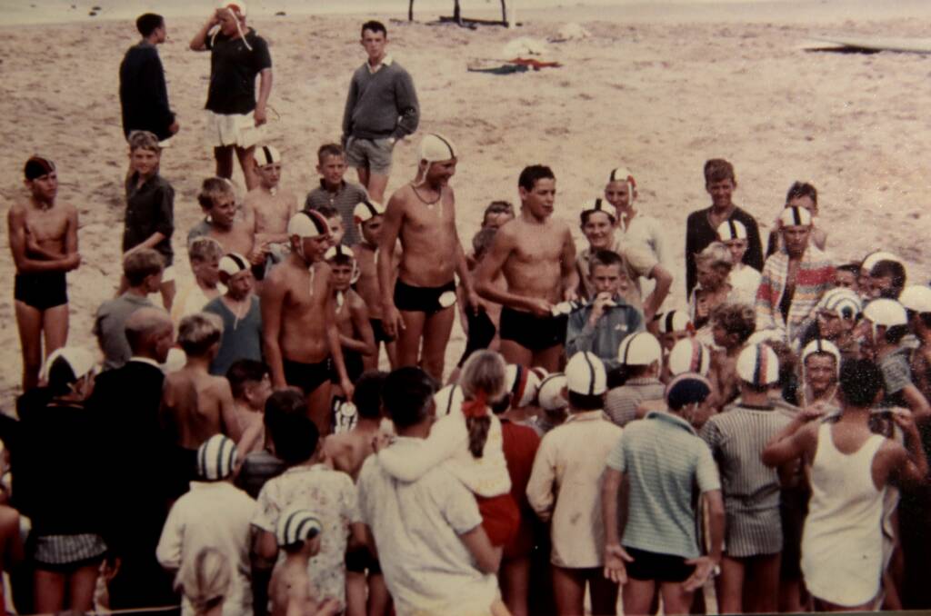 Larry Jennett (pictured centre on podium) has been a surf lifesaver since 1962, when he was 12 years old. Picture supplied