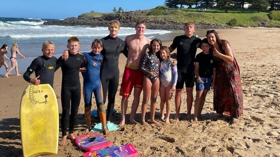 Braith Davidson, Max Laird, George Griffin, Harrison Smee, AlexNorris and Zach Marsden with some of the people they rescued from a rip on Saturday, November 18 at Kiama Surf Beach. Pictures supplied