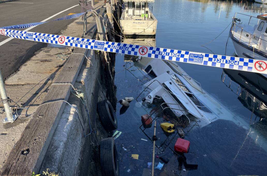 A boat sank in Wollongong Harbour on Tuesday, July 25, with debris and fuel spilling out into the waterway. Picture by Nadine Morton