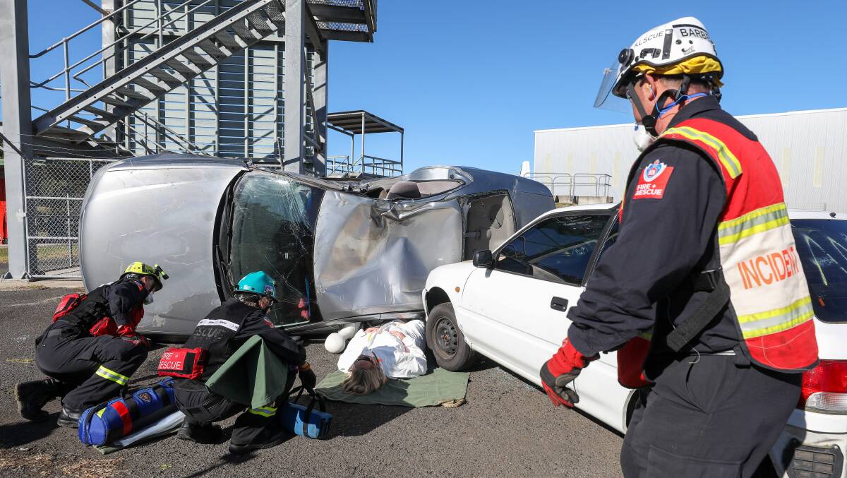 Illawarra Mercury journalist Nadine Morton volunteered to be a car accident victim in a training session for Wollongong firefighters, before they compete in the Australasian Rescue Challenge 2023 in Adelaide this week. Pictures by Adam McLean 