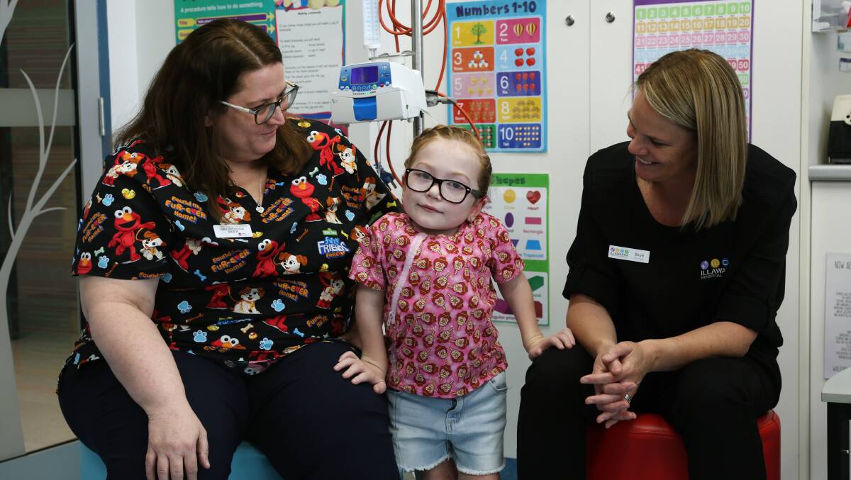 Wollongong Hospital children's ward nurse unit manager Julie Haines, Illawarra Hospital School principal Skye Gray and student Ivy Brown, 8. Picture by Sylvia Liber 