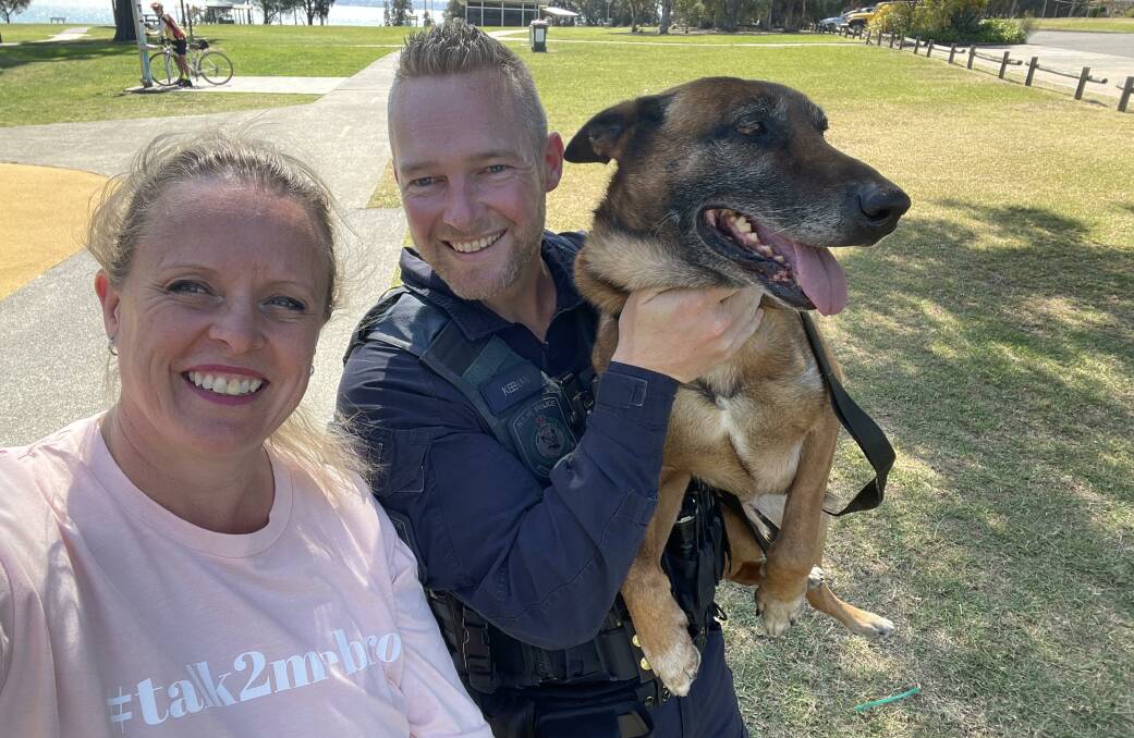 Senior Constable Mitch Keenan and police dog Mike, with Illawarra Mercury journalist Nadine Morton walking for Talk2MeBro at Mount Warrigal on September 19. 