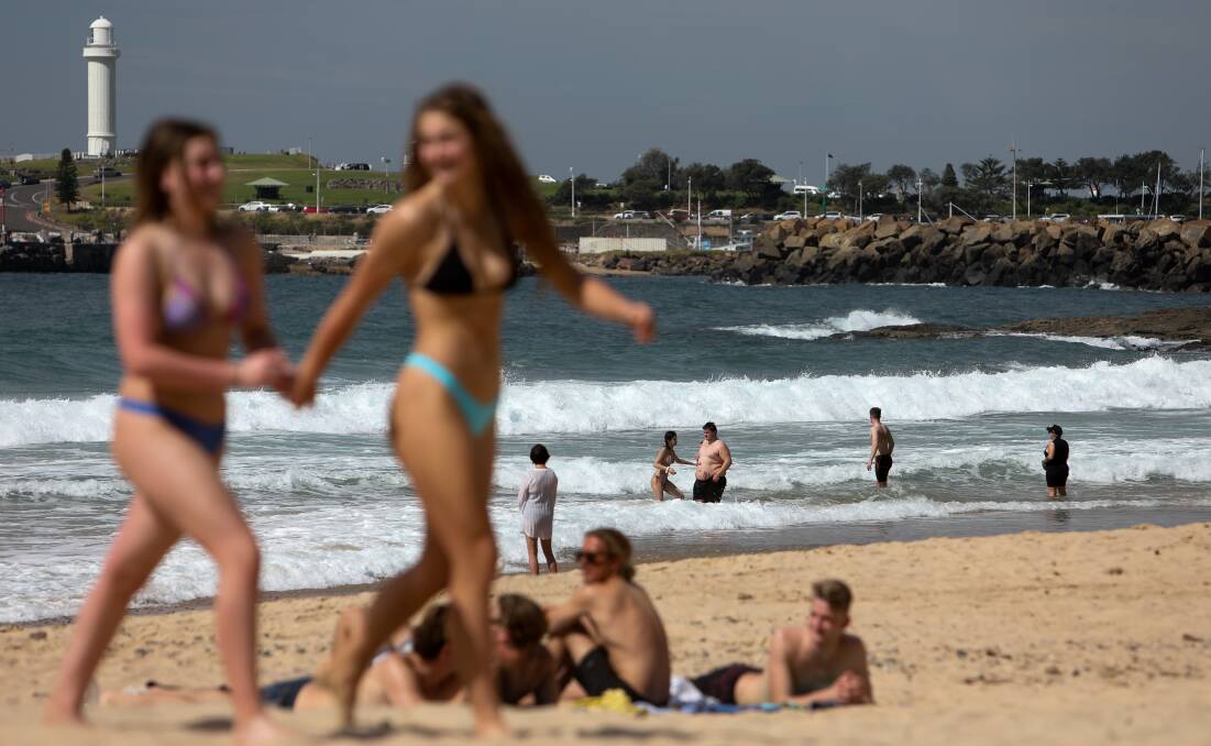 People enjoying the warm weather at North Wollongong beach. File picture by Adam McLean.
