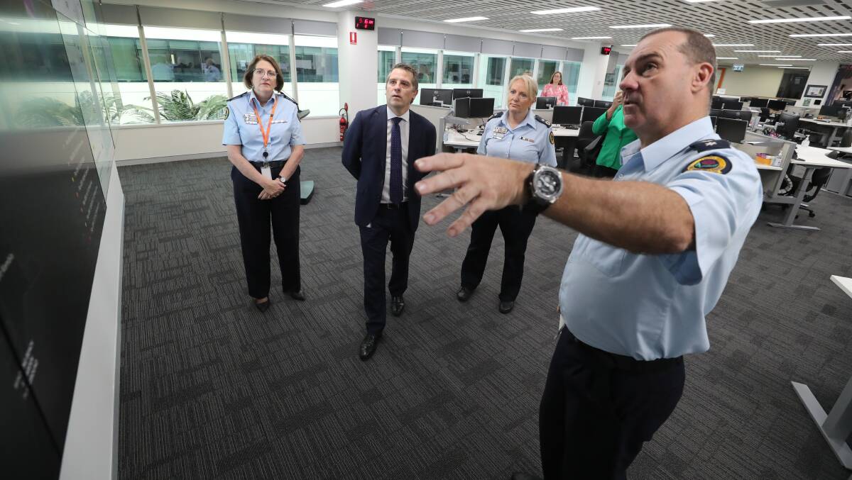 SES Commissioner Carlene York, deputy commissioner Debbie Platz, senior manager state operations Dallas Burnes and (second from left) MP Ryan Park at the SES command centre in Wollongong. Picture by Robert Peet