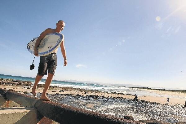 Surfer Paul Hellier at Port Kembla Beach. Picture: SYLVIA LIBER