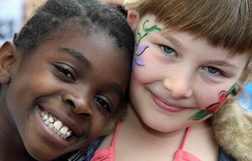 Dorcas Toweh, 7, and Kayla Lynn, 9, at yesterday's Berkeley community barbecue. Picture: GREG TOTMAN