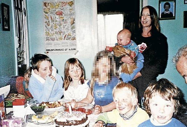 The three children who died in the Pericoe murder-suicide enjoy a party with friends. Left is Jack Bell, then 7, with sister Maddie, then 5, and brother Bon, being held by mother Karen Bell. Also pictured is friend Lachlan Wilson, who was with his mother at the crime scene when the bodies were found on Friday, and his brother Saxon.