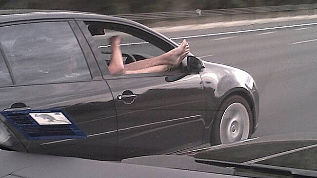 The feet-first freeway driver.