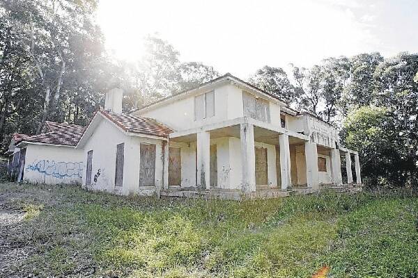 Residents want the partially-constructed mansions demolished.