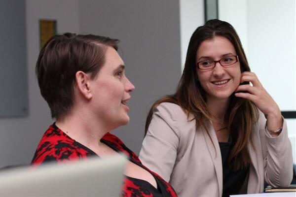 Jenna Tregarthen (right)  talks to UOW commercialisation manager Tamantha Stutchbury  about a new application she has developed to help  women battling eating disorders. Photo: GREG ELLIS