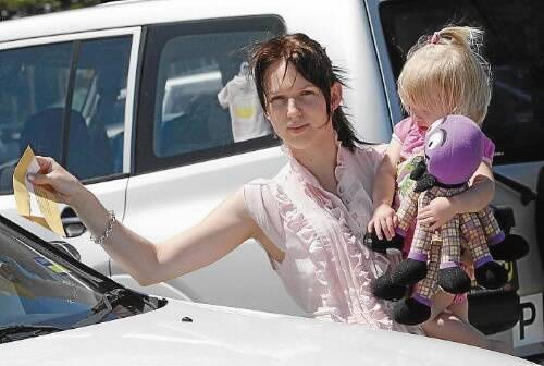 Wiggles concert-goer Melissa Webb, who was hit with a parking fine, with her daughter Selena. Picture: ANDY ZAKELI