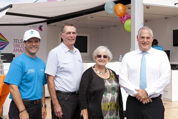 Telstra customer service manager Tony Naumovski, with Telstra’s first Kiama customers on the NBN Barry and Judy Spooner and Telstra area general manager Michael Marom  in Kiama Downs.