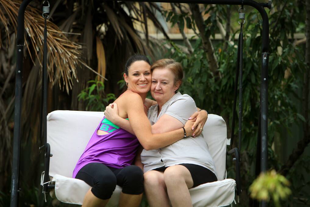 Strong: Michelle Briant and Sue Scott are very close neighbours. Michelle is doing a 10-kilometre run for Sue, who has cancer, at Huskisson tomorrow. Picture: SYLVIA LIBER