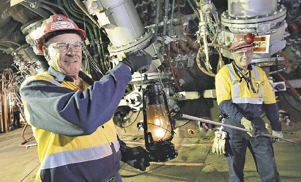 Super send-off: Expert steelmakers Peter Cross (left) and Syd Webb help blast Port Kembla's No 5 furnace into a new era. Picture: ANDY ZAKELI