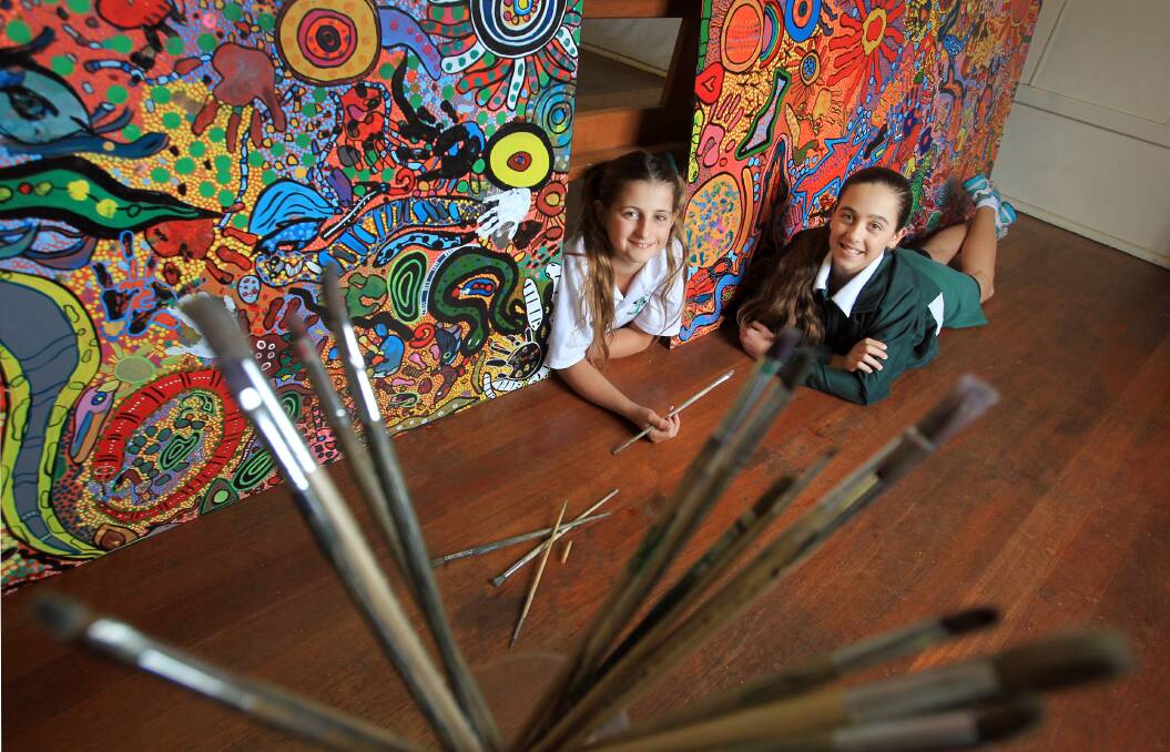 St Patrick's Catholic Primary School pupils Alyssa Norris and Lara Maccagnan with the mural. Picture: ORLANDO CHIODO