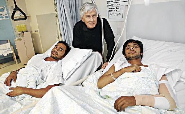 Tandel Ramchandra (left) and Godara Rishav with David Masters as they recover at Wollongong Hospital. Picture: DAVE TEASE