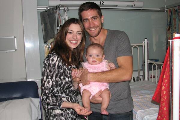 Hollywood stars Anne Hathaway and Jake Gyllenhaal with little Payton Gilmour.