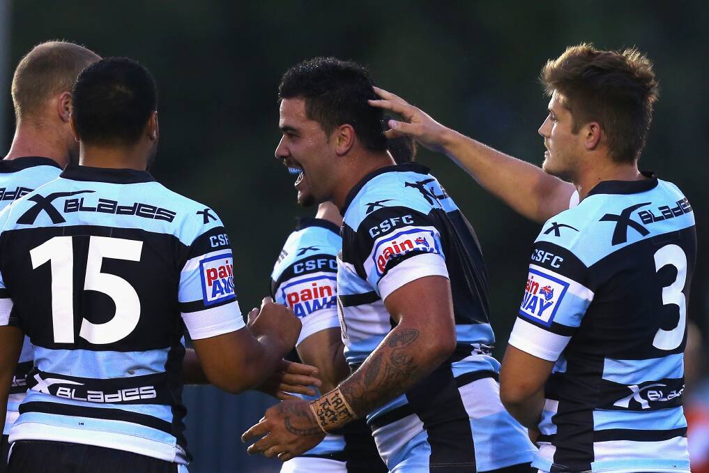 Andrew Fifita celebrates scoring for the Sharks in a trial game on Saturday against the Tigers. Picture: GETTY IMAGES