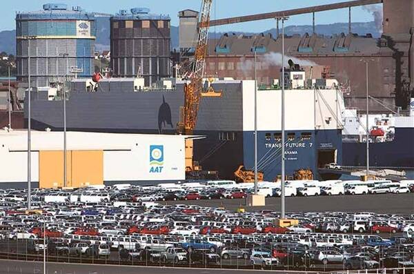Cars imported from Japan are unloaded from The Trans Future 7 cargo ship at the AAT Terminal at Port Kembla Harbour. Picture: KIRK GILMOUR