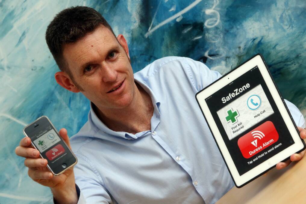 Glenn Farrant (pictured left) from Critical Arc with his security app. Picture: ROBERT PEET