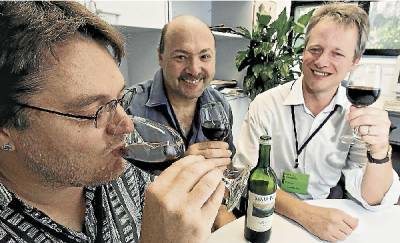 Geoff Mercer, Tim Marchant and Philip Giesbertz sip wine in the interests of research.  Picture: ROBERT PEET