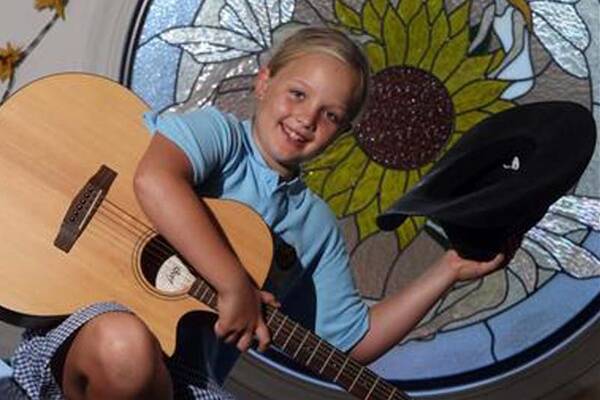 Pint-sized musician Shalani Thomas, 9, won the runner-up prize in a talent quest at the Tamworth Country Music Festival last month, where she performed her parents’ wedding song, Kasey Chambers’ Flower. Picture: ROBERT PEET