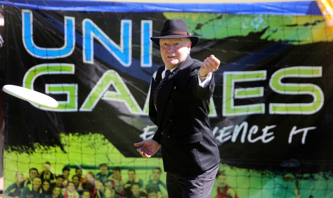 Lord Mayor Gordon Bradbery chances his arm, frisbee-wise, to launch Wollongong's university games. Picture: ROBERT PEET
