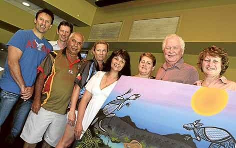Laurie Daley (left), MP Stephen Jones, Uncle Richard Archibald, Kim Purdie, Sharralyn Robinson, Judy Graham, Col Markham and Denise McConnachie with a painting auctioned during Sunday's family day at Dapto. Picture: ANDY ZAKELI