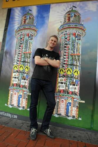 Artist Brett Ashby with his artworks set to decorate the corner of Crown and Keira streets. Picture: KEN ROBERTSON