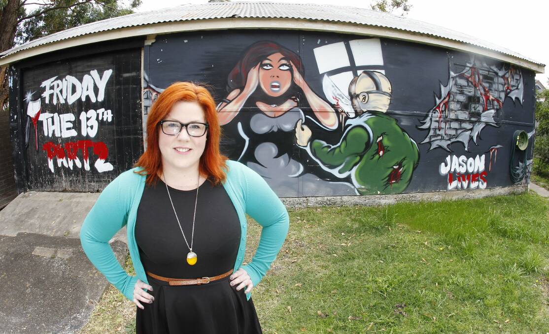 House seller Samantha Dorahy hopes  a buyer will appreciate the Friday the 13th mural on the shed behind her.  Pictures: ANDY ZAKELI