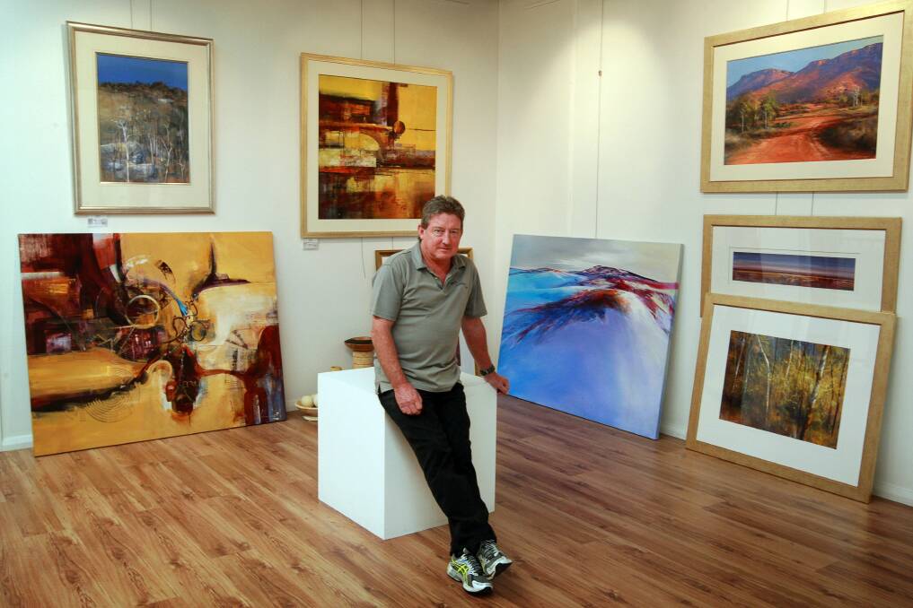 Gary Laird is hosting the first exhibition in his Albion Park gallery, featuring his own paintings and those of local artists. Picture: SYLVIA LIBER