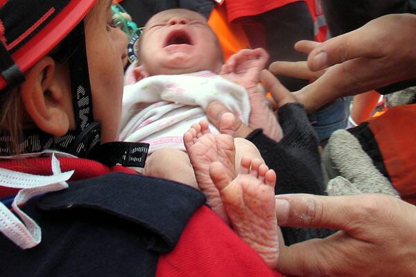 A 2-week-old baby girl, Azra Karaduman, was pulled alive from the rubble of an apartment building, nearly 48 hours after a 7.2-magnitude earthquake that toppled some 2,000 buildings in eastern Turkey. Photo: (AA/Abaca Press/MCT)