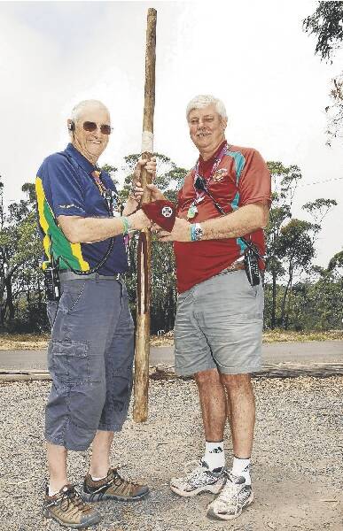 Camp director Bob Baker hands over the pole of authority to AJ2013 chief director Pieter Van Der Kamp. The next camp will be held in Queensland.